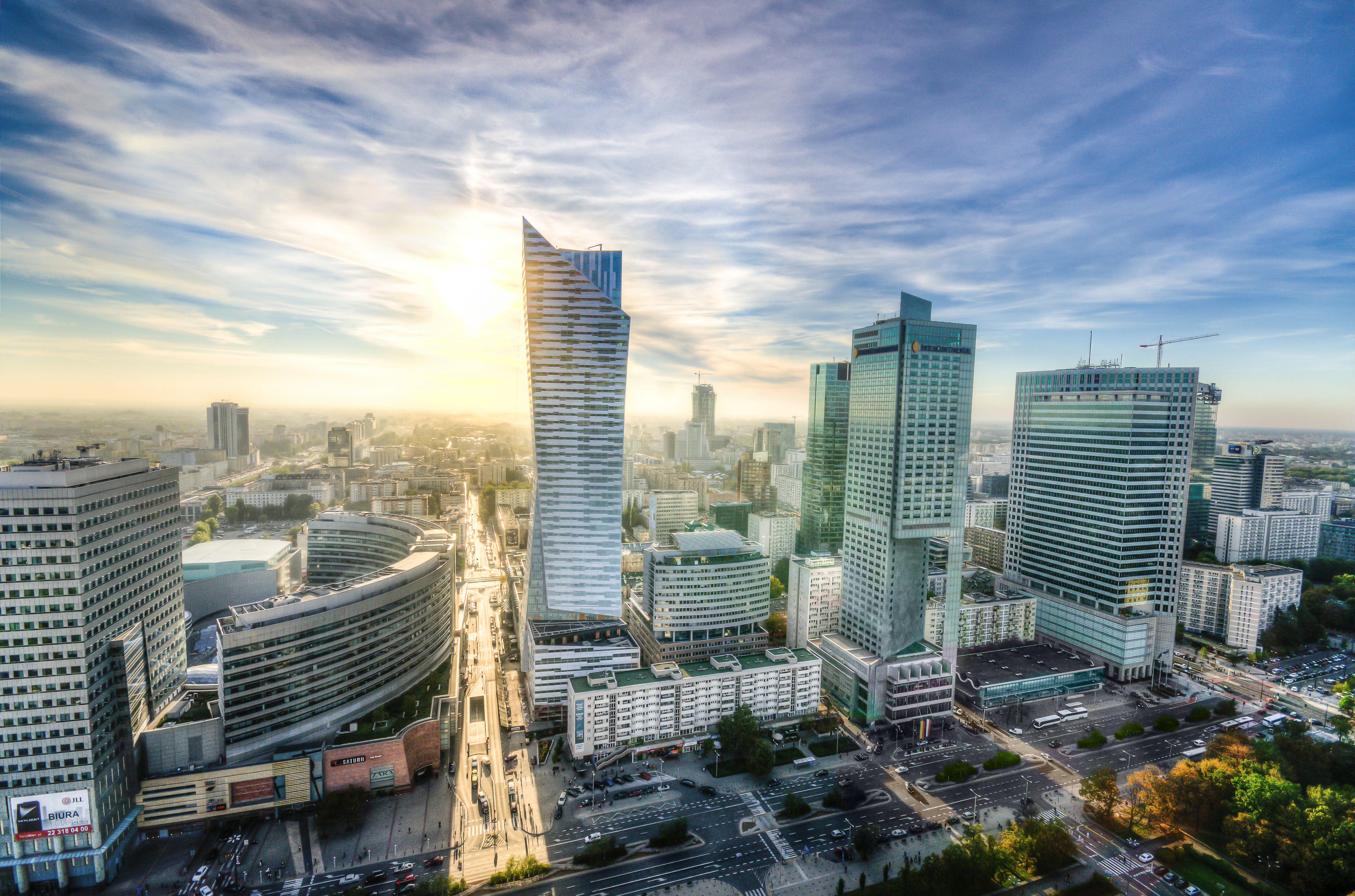 Złota 44 and the Warsaw skyline at sunset